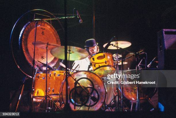 John Bonham of Led Zeppelin performs on stage at Ahoy on 12th January 1975 in Rotterdam, Netherlands. He wears a bowler hat and plays a Ludwig Amber...