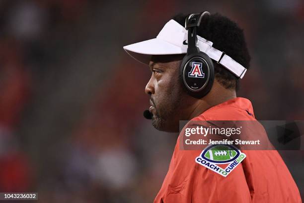 Jead coach Kevin Sumlin of the Arizona Wildcats looks on during the first half of the game against the USC Trojans at Arizona Stadium on September...