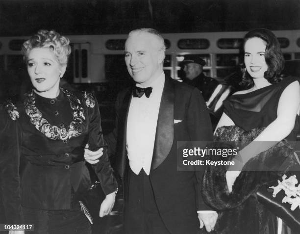 Comic actor Charlie Chaplin and his wife Oona O'Neill with Canadian actress Mary Pickford at the premiere of Chaplin's film 'Monsieur Verdoux' at the...