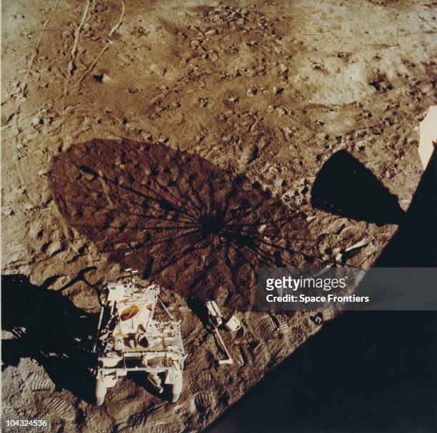 The Modular Equipment Transporter at bottom left, and the Apollo 35mm stereo close-up camera near a shadow of the erectable S-band Antenna during the...