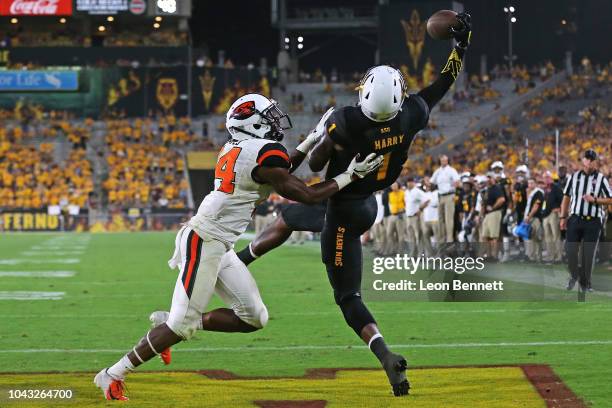 Wide receiver N'Keal Harry of the Arizona State Sun Devils attempted catch against Oregon State Beavers defender at Sun Devil Stadium on September...