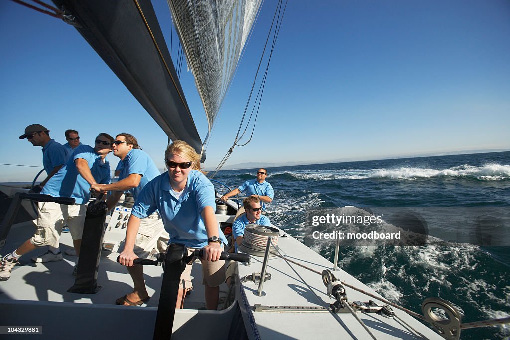 Sailing team on yacht