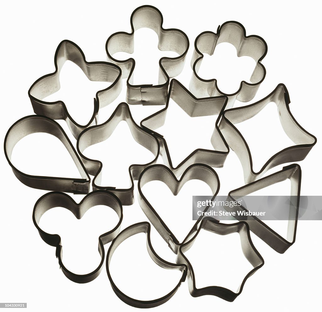 A bunch of tin cookie cutters