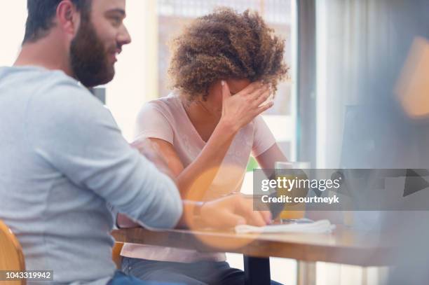 couple fighting at the breakfast table. - boyfriend crying stock pictures, royalty-free photos & images