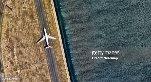 aerial view of sydney international airport. australia - airport aerial stock pictures, royalty-free photos & images