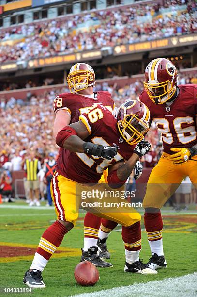 Clinton Portis of the Washington Redskins celebrates a touchdown during the game against the Houston Texans at FedExField on September 19, 2010 in...