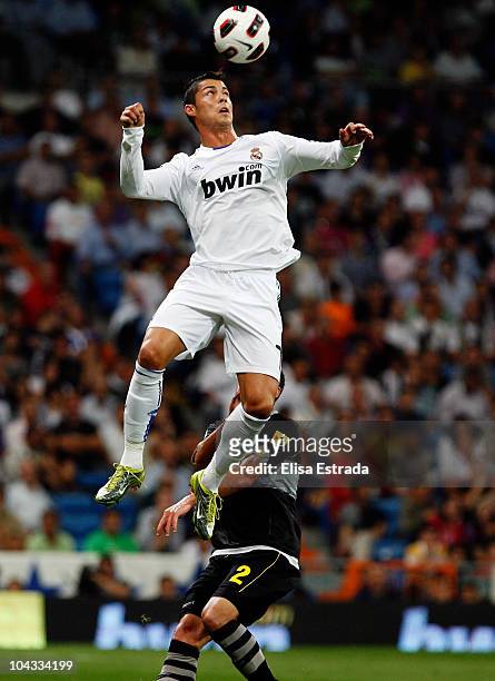 Cristiano Ronaldo of Real Madrid jumps for a high ball during the La Liga match between Real Madrid and Espanyol at Estadio Santiago Bernabeu on...