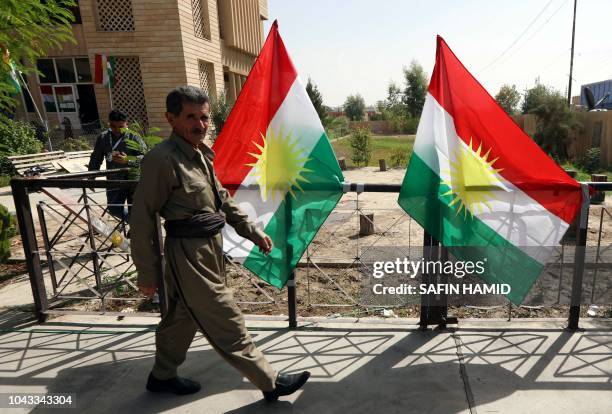 An Iraqi Kurdish man leaves after casting his ballot for the parliamentary election at a polling station in Arbil, the capital of the Kurdish...