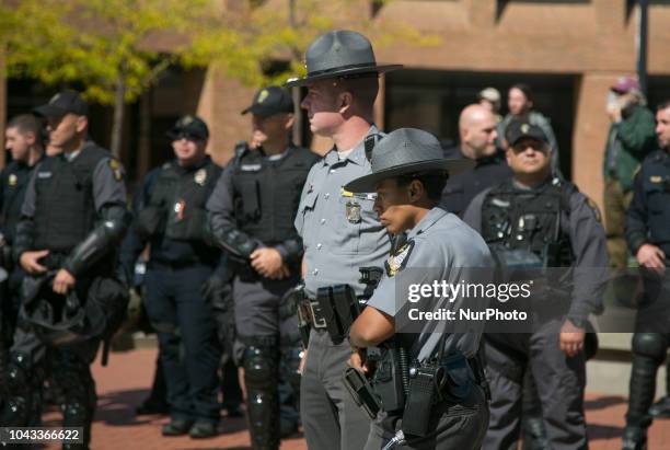 Police stand by during an open carry rally at Kent State University in Kent, Ohio on September 29, 2018.