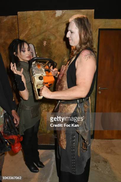 Actress Celine Tran ex-Katsuni and and a guest disguised in chainsaw slaughter Attend 'The End Apocalypse Party' at Hotel Kube on September 29, 2018...