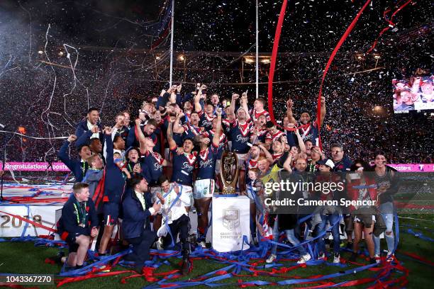 The Roosters celebrate winning the 2018 NRL Grand Final match between the Melbourne Storm and the Sydney Roosters at ANZ Stadium on September 30,...