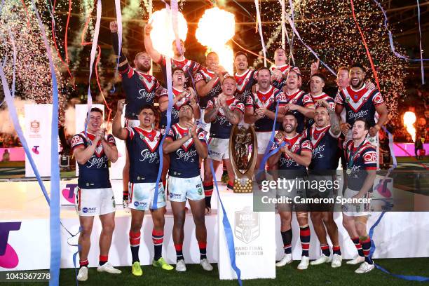 The Roosters celebrate winning the 2018 NRL Grand Final match between the Melbourne Storm and the Sydney Roosters at ANZ Stadium on September 30,...