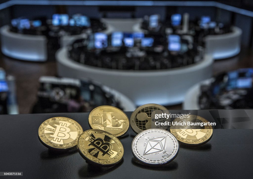 Symbol photo on the topics digital currencys, cryptocurrency, currency speculation - Bitcoin, Ripple, Ethereum, Litecoin.