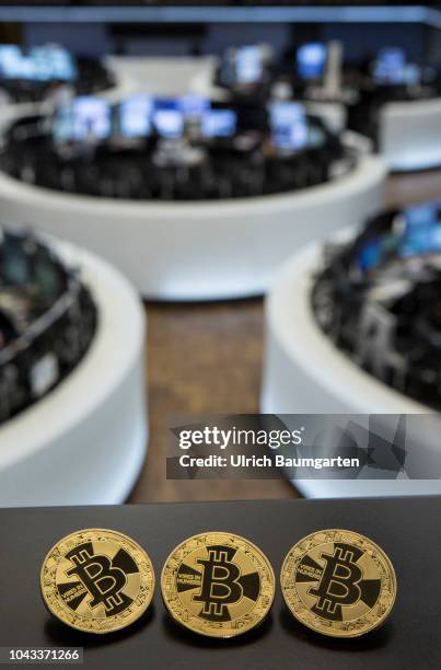 Symbol photo on the topics digital curreny, cryptocurrency, currency speculation, stock market, etc. The picture shows Bitcoin on the balcony of the...