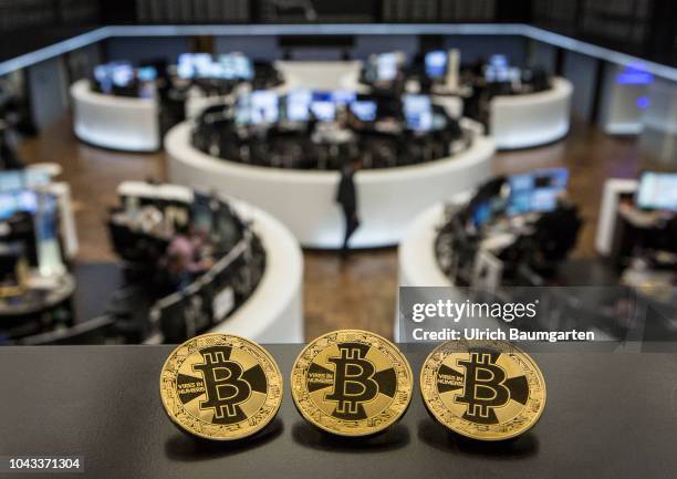 Symbol photo on the topics digital curreny, cryptocurrency, currency speculation, stock market, etc. The picture shows Bitcoin on the balcony of the...