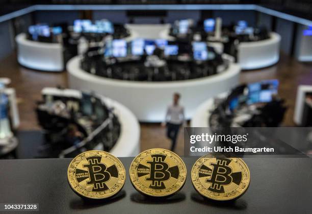 Symbol photo on the topics digital curreny, cryptocurrency, currency speculation, stock market, etc. The picture shows Bitcoin on the balcony of the...