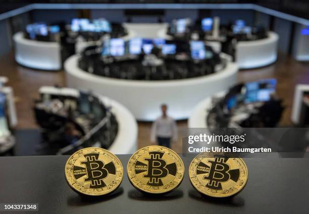 Symbol photo on the topics digital curreny, cryptocurrency, currency speculation, stock market, etc. The picture shows Bitcoin on the balcony of the...