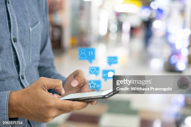 hand touch screen smart phone. application icons interface on screen. social media concept - following map stock pictures, royalty-free photos & images