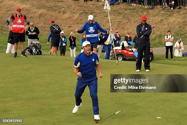 Jon Rahm of Europe celebrates winning his match on the 17th during singles matches of the 2018 Ryder Cup at Le Golf National on September 30, 2018 in...