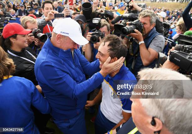 Francesco Molinari of Europe celebrates winning The Ryder Cup with Captain Thomas Bjorn of Europe during singles matches of the 2018 Ryder Cup at Le...