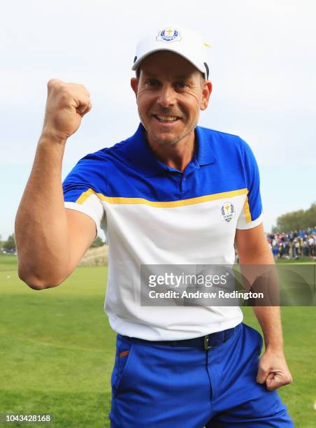 Henrik Stenson of Europe celebrates winning his match and winning The Ryder Cup during singles matches of the 2018 Ryder Cup at Le Golf National on...