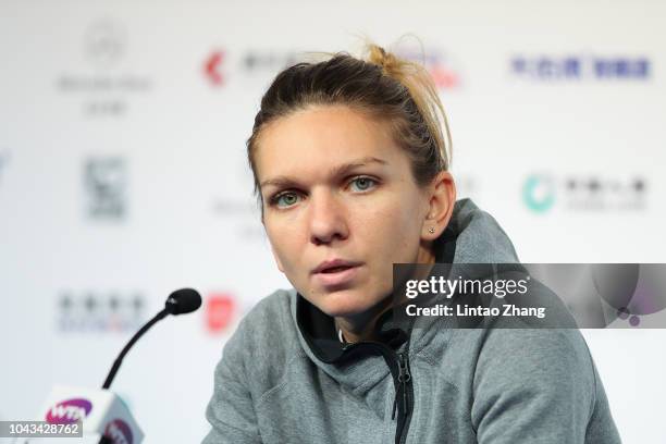 Simona Halep of Romania reacts during a press conference after losing to Ons Jabeur of Tunisia in their Women's Singles 1nd Round match of the 2018...