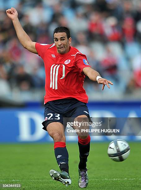 Lille's French defender Adil Rami passes the ball during the French L1 football match Lille vs. Auxerre on September 19, 2010 at Lille metropole...