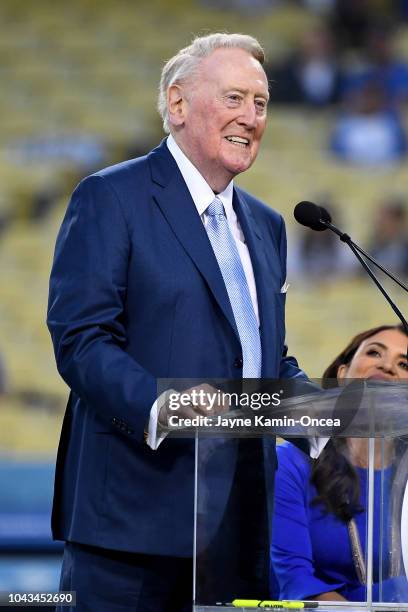 Retired Dodgers broadcaster Vin Scully, left speaks during a pregame ceremony honoring language broadcaster Jaime Jarrin inducting him into the...