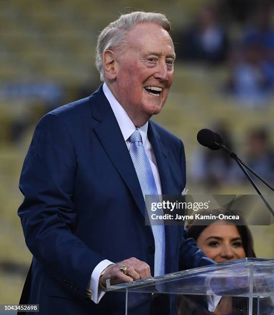 Retired Dodgers broadcaster Vin Scully, left speaks during a pregame ceremony honoring language broadcaster Jaime Jarrin inducting him into the...