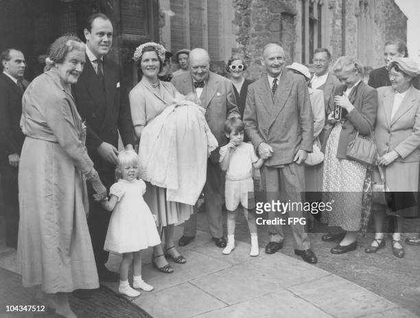 British Prime Minister Winston Churchill attends the christening of his grandson Jeremy Soames at Westerham Paraish Church in Kent, 17th August 1952....