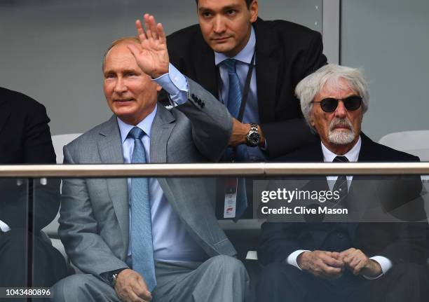 Russia President Vladimir Putin and Bernie Ecclestone, Chairman Emeritus of the Formula One Group, watch the action during the Formula One Grand Prix...