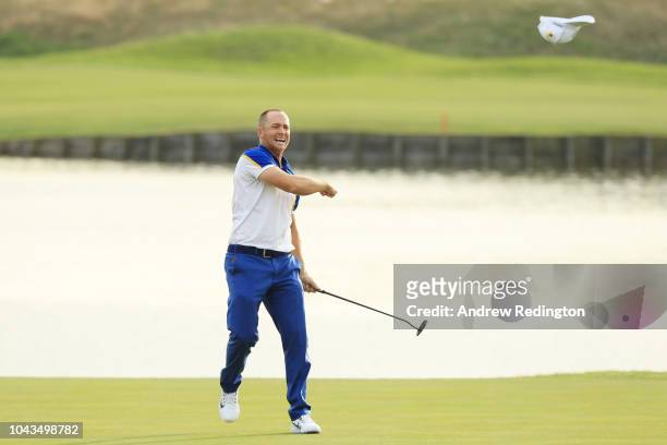 Alex Noren of Europe celebrates winning his match on the 18th green as Europe win The Ryder Cup during singles matches of the 2018 Ryder Cup at Le...