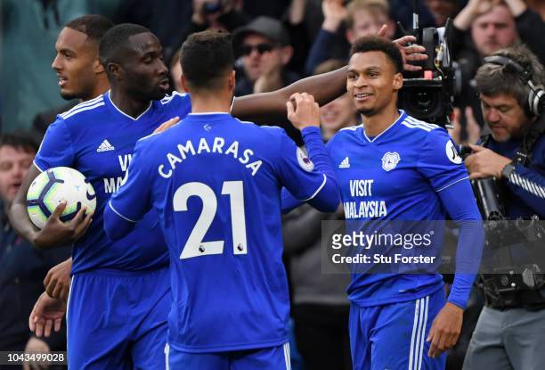 Josh Murphy of Cardiff City celebrates with teammates after scoring his team's first goal during the Premier League match between Cardiff City and...