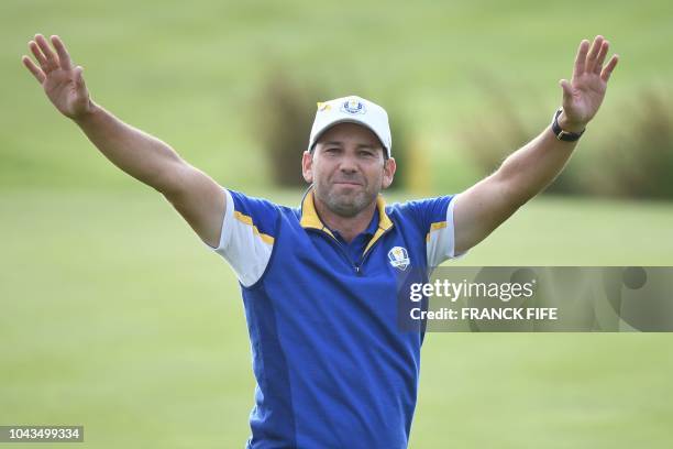 Europe's Spanish golfer Sergio Garcia reacts on the third day of the 42nd Ryder Cup at Le Golf National Course at Saint-Quentin-en-Yvelines,...