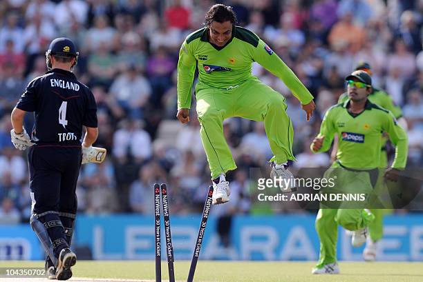 Pakistan's bowler Shoaib Akhtar , jumps the stumps after bowling England's Jonathan Trott , for 3 runs on the fifth One Day International cricket...