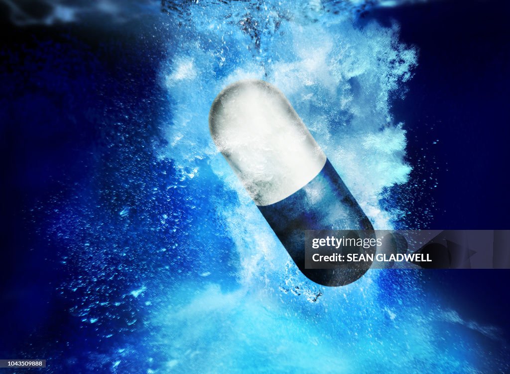 Medical pill in water