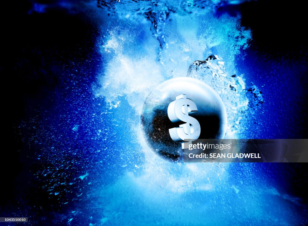 Dollar sphere sinking underwater