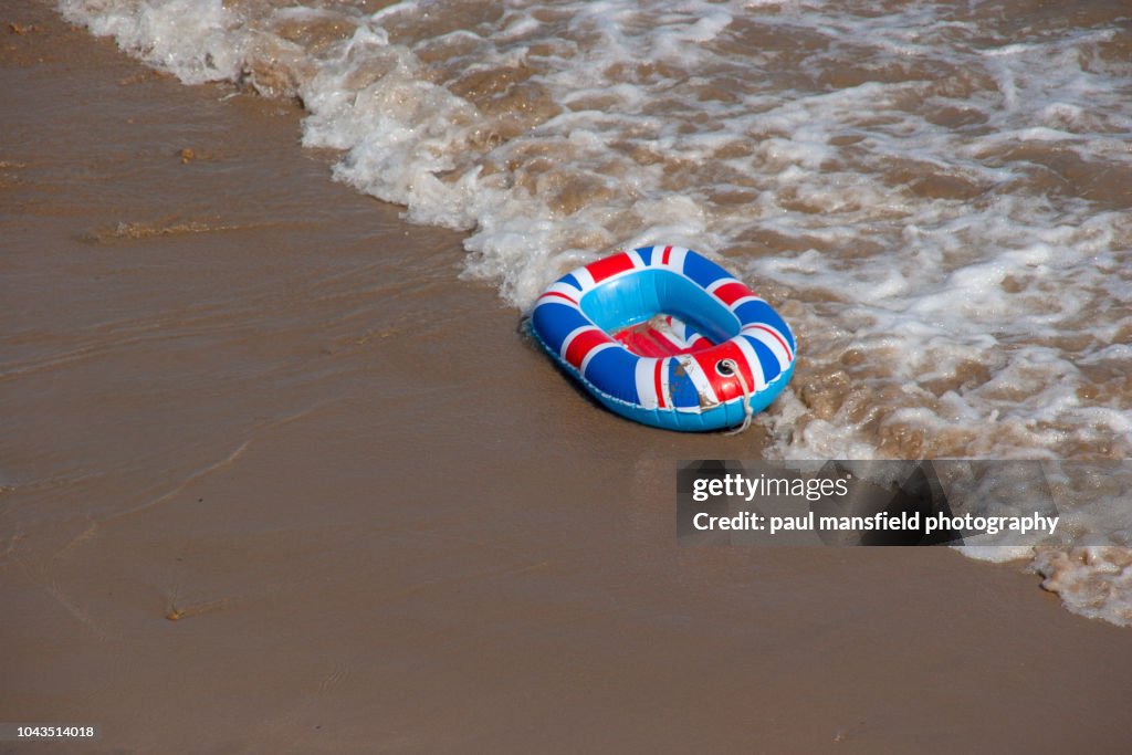 A united kingdom inflatable boat at waters edge