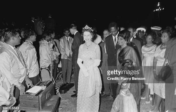 Queen Elizabeth II at a reception given by Forbes Burnham , the Prime Minister of Guyana, in Georgetown, British Guyana, during a royal tour of the...