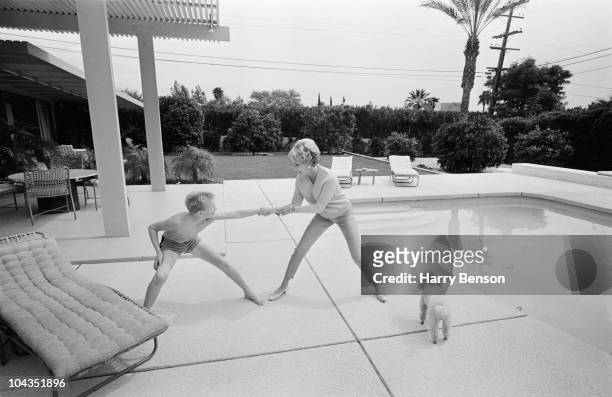 Anne Buydens, wife of American actor Kirk Douglas, with their son Eric , 22nd March 1966.