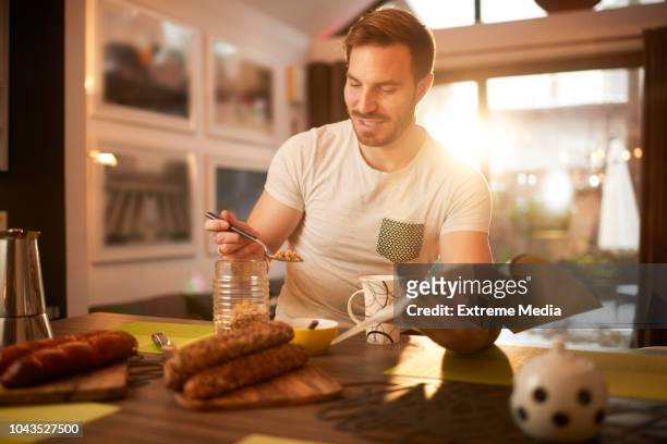 man at home having coffee and breakfast - media breakfast stock pictures, royalty-free photos & images