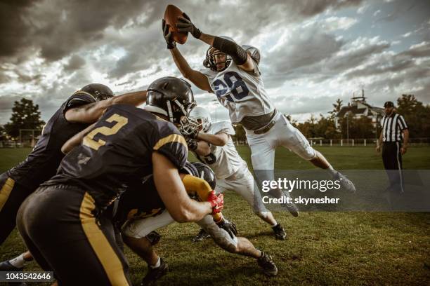 american football match! - first down american football stock pictures, royalty-free photos & images