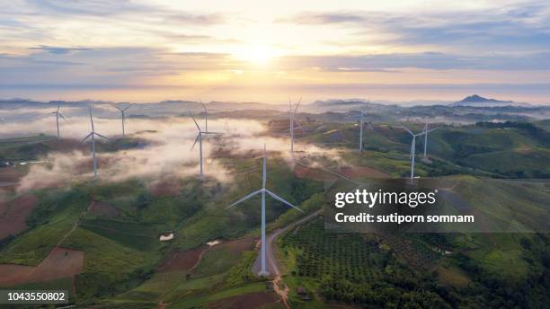 green energy wind turbine, aerial view from drone flying wind turbines - flying drone stock-fotos und bilder