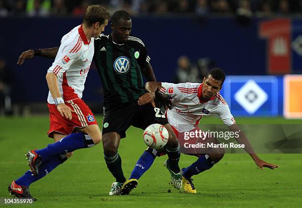 Maxim Choupo Moting of Hamburg and Grafite of Wolfsburg battle for the ball during the Bundesliga match between Hamburger SV and VFL Wolfsburg at...