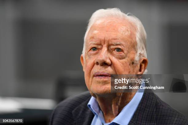 Former president Jimmy Carter prior to the game between the Atlanta Falcons and the Cincinnati Bengals at Mercedes-Benz Stadium on September 30, 2018...