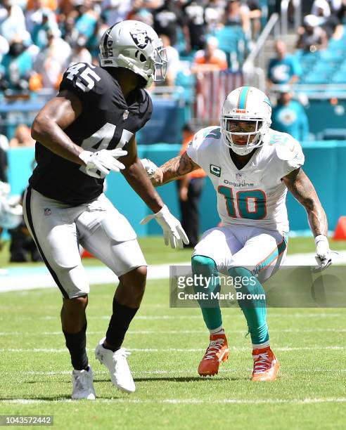 Kenny Stills of the Miami Dolphins in action against Dominique Rodgers-Cromartie of the Oakland Raiders during the game between the Miami Dolphins...
