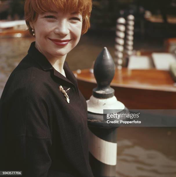 American actress Shirley MacLaine posed beside a canal during the 1960 Venice International Film Festival in Venice, Italy in September 1960. Shirley...