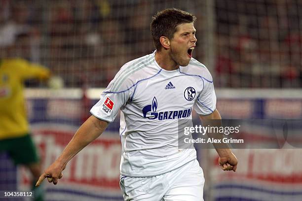 Klaas-Jan Huntelaar gee celebrates his team's second goal during the Bundesliga match between SC Freiburg and FC Schalke 04 at the Badenova Stadium...