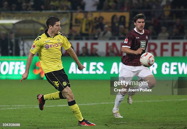 Robert Lewandowski of Dortmund scores his team's fourth goal during the Bundesliga match between Borussia Dortmund and 1. FC Kaiserslautern at Signal...