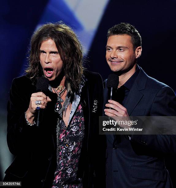 Singer Steven Tyler and host Ryan Seacrest appear onstage at a press conference to officially announce the season 10 "American Idol" judges panel at...